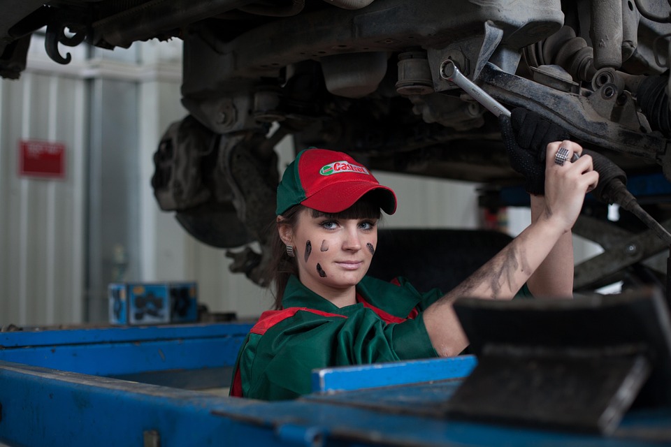 woman repairing car 